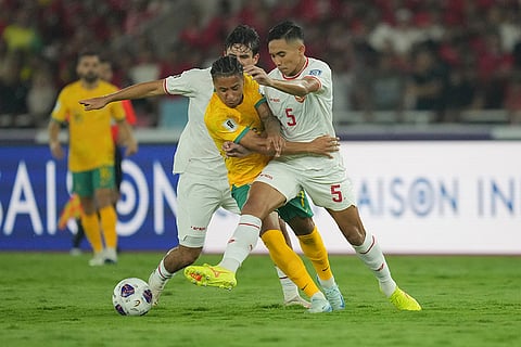 2026 FIFA World Cup Qualifying, Indonesia Australia: Australia's Samuel Silvera, center battles for the ball against Indonesia's Rizki Ridho Ramadhani, right, and Nathan Tjoe A On